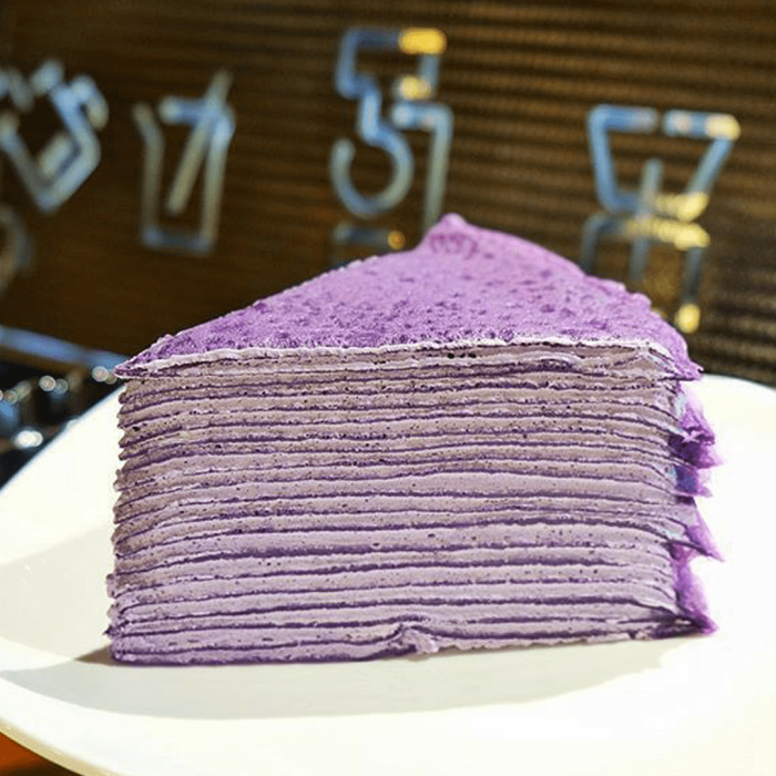 ube crepe cake sliced