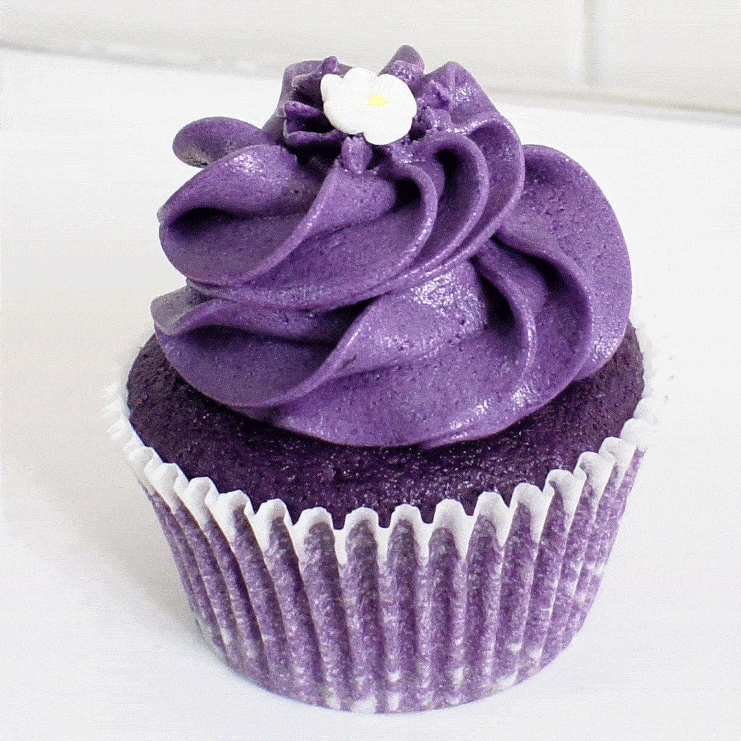 Ube cupcakes with ube frosting on a plate