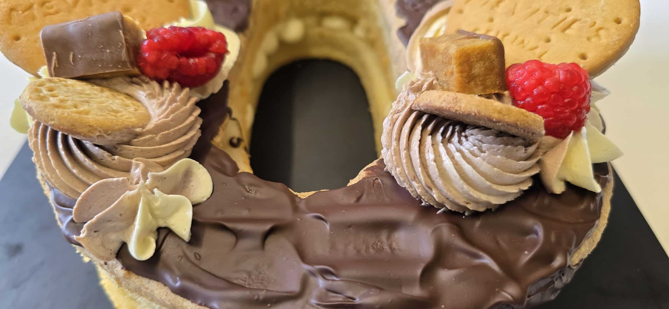 Quiet-luxury sculpted number cake with clean layers and brand-approved detailing for McVitie’s 100-year celebration.